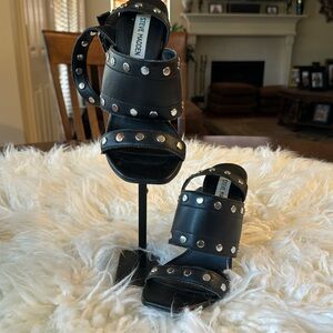 Steve Madden black heeled sandals.